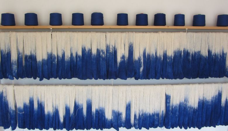Looms of IKAT - IKAT Blue & white textile from Mallorca, that bears a characteristic pattern obtained by the process of resist dying, and the island of Mallorca is the only place where you can still visit family-run workshops that have been operating for 
