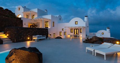 Cycladic archtitecture on Santorini, black on white, typical roof tops at Aenaon Villas Caldera 