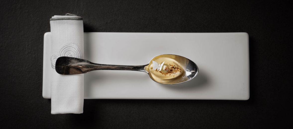 Gourmet Food Design - Spoon resting on a napkin against a black table | Foodie Images | Chef Ramon Freixa | Spain's Next Culinary Legend