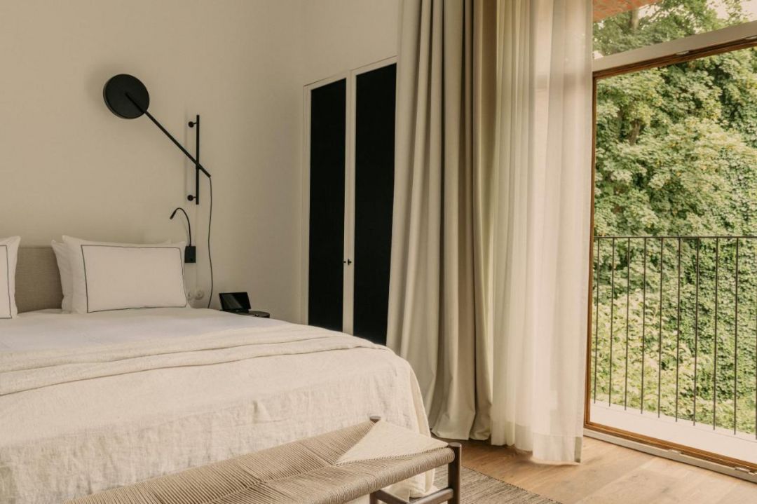 Design Bedroom overlooking gardens | Hotel August Antwerp designed by architect: Vincent Van Duysen | The Aficionados