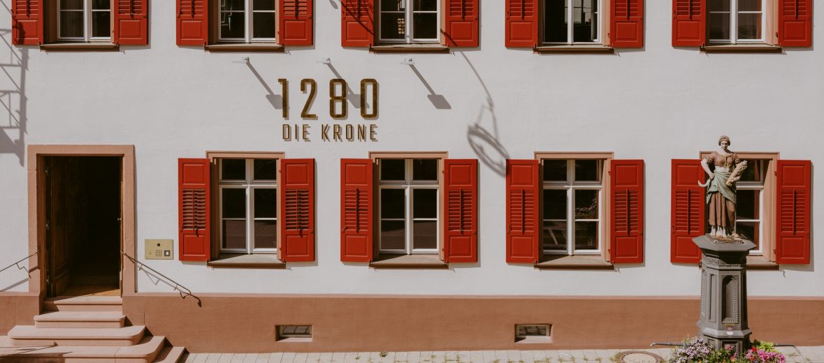 Red shuttered facade - accidential wes anderson - 1280 Krone Design Hotel in Geisingen, Baden-Würtemberg Germany 