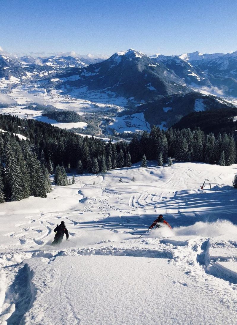 Bödele ski in the Austrian Alps in Vorarlberg, perfect sunny day on the piste, blue sky, sun, snow