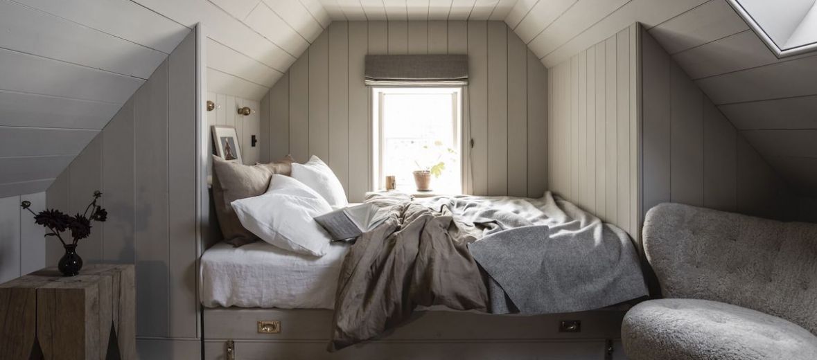 Luxury loft Bedroom Suite in oatmeal paints +natural linens  - Scandi-Scot interior design as found at Lundies House Sutherland Scotland
