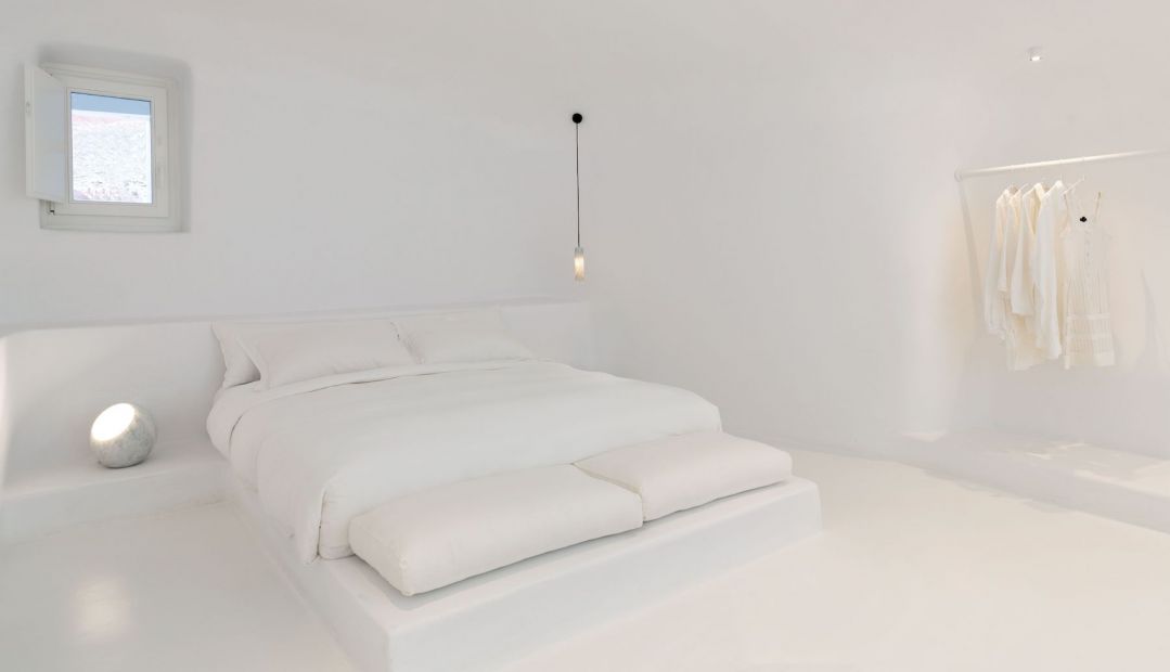 Design interiors Cyclades White, luxury bedroom, Villa Charissa at Aenaon Villas Santorini designed by Elly Alexiou (Architect) and Maria-Christina Alexiou 