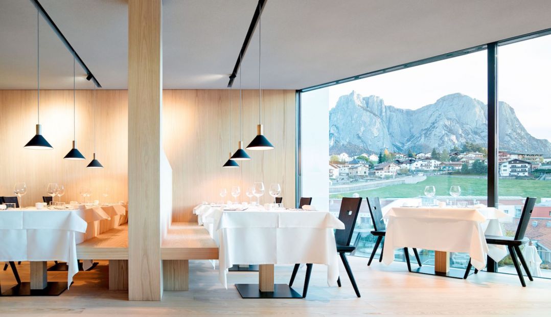 Restaurant with a view to the Dolomites - Luxury hotel interior design - at the Hotel Schgaguler Castelrotto in Alpe di Siusi South Tyrol designed by Peter Pichler Architecture  